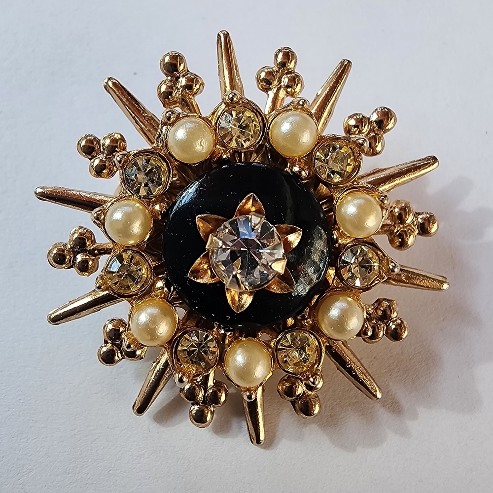 Elegant Gold and Black Brooch